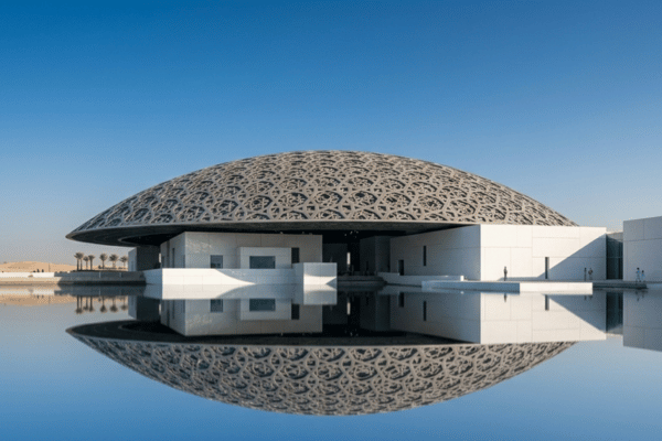 Aerial drone view of Louvre Abu Dhabi surrounded by turquoise water